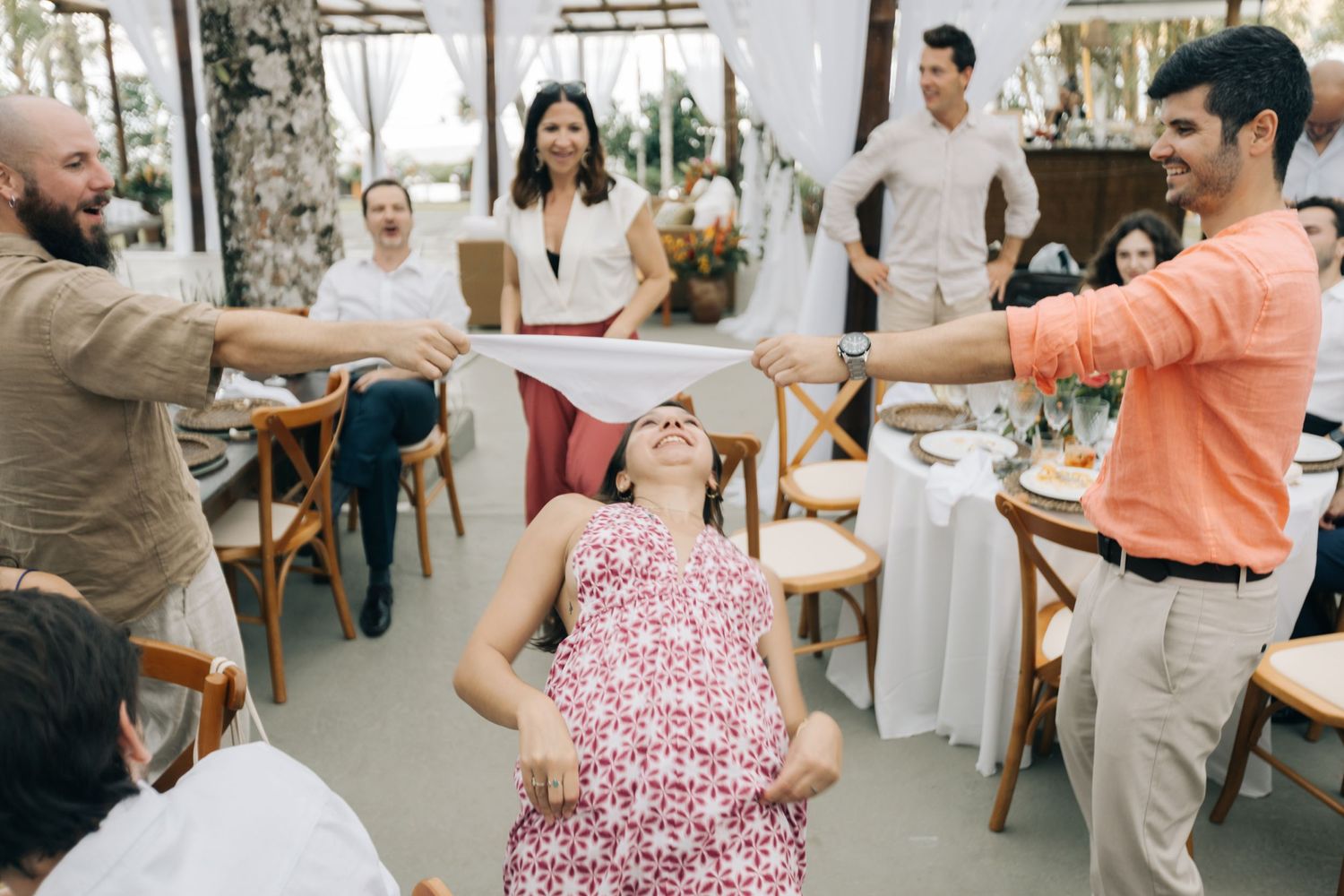Group of wedding guests enjoying a fun dance moment at reception.