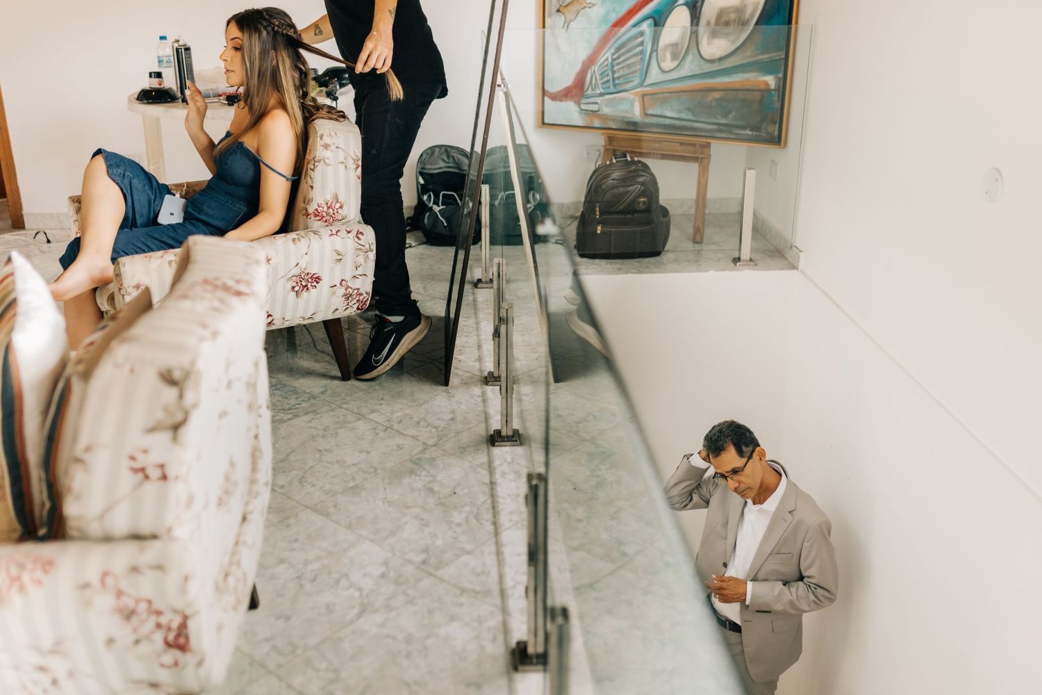 Wedding preparation scene with mirror reflection and staircase.