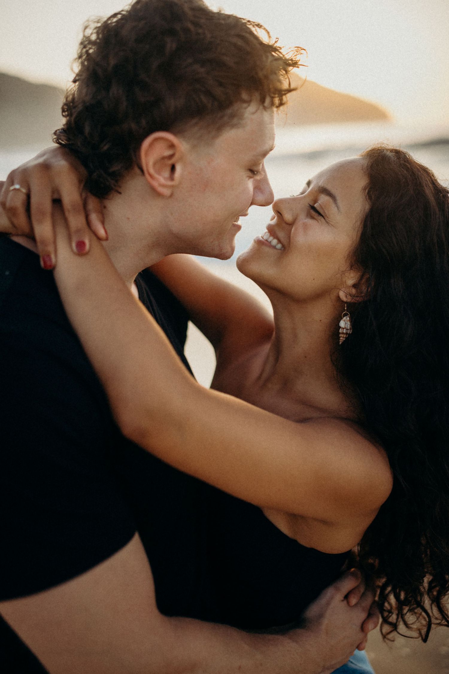 Romantic indoor portrait session with soft natural lighting.
