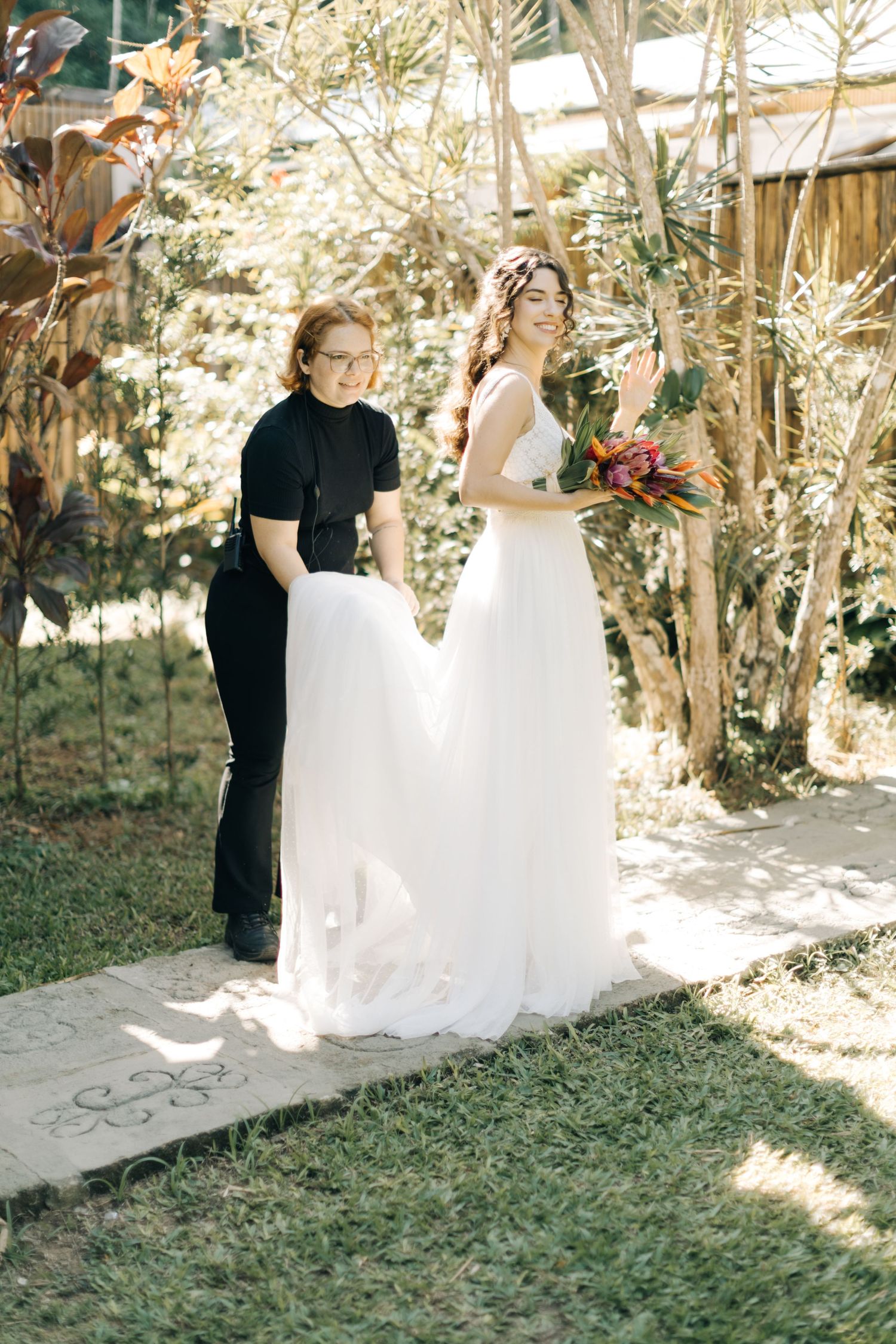 Candid wedding moment captured in a rustic outdoor setting with natural light.