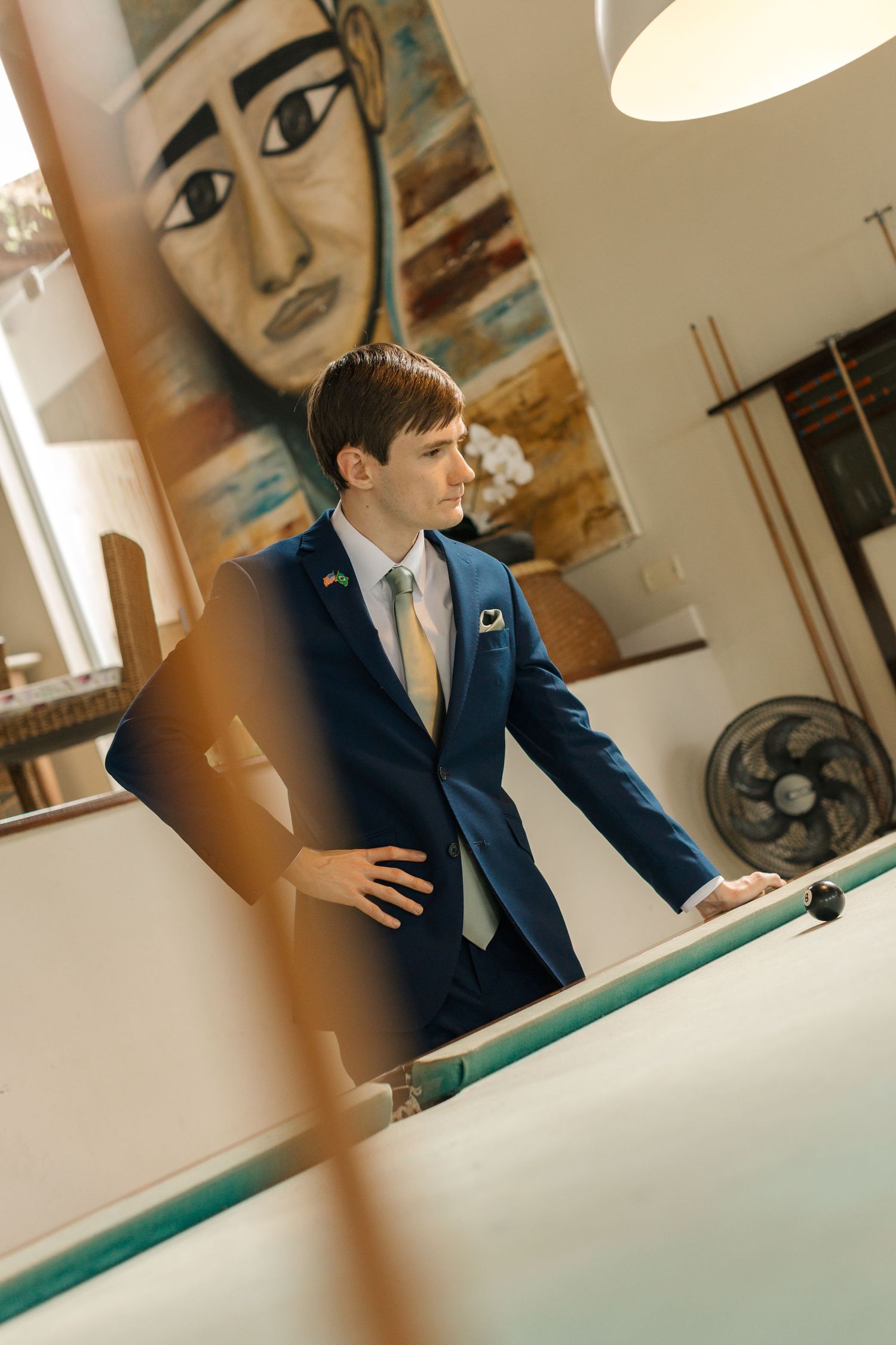 Professional office setting with blue suit and business attire at a conference table.