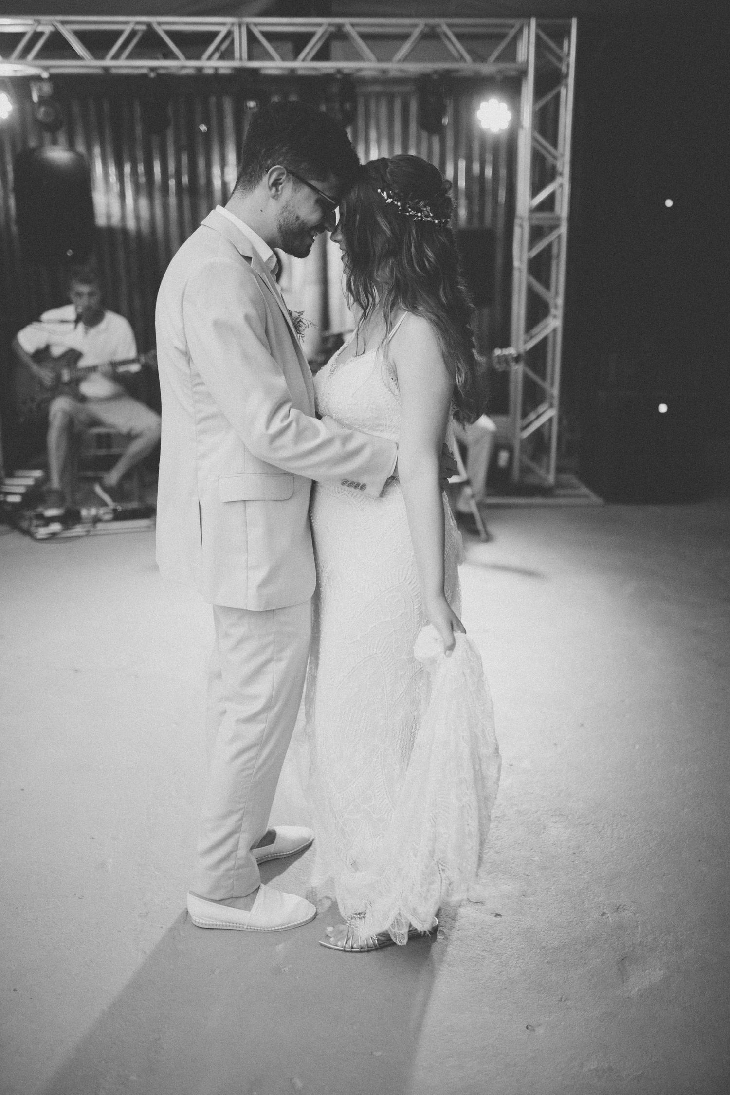 Intimate black and white shot of couple sharing a moment during first dance.