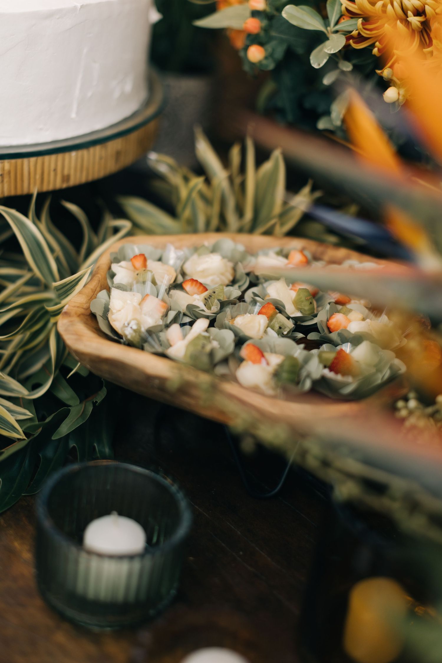Elegant seafood appetizers arranged on wooden platters with fresh herbs.