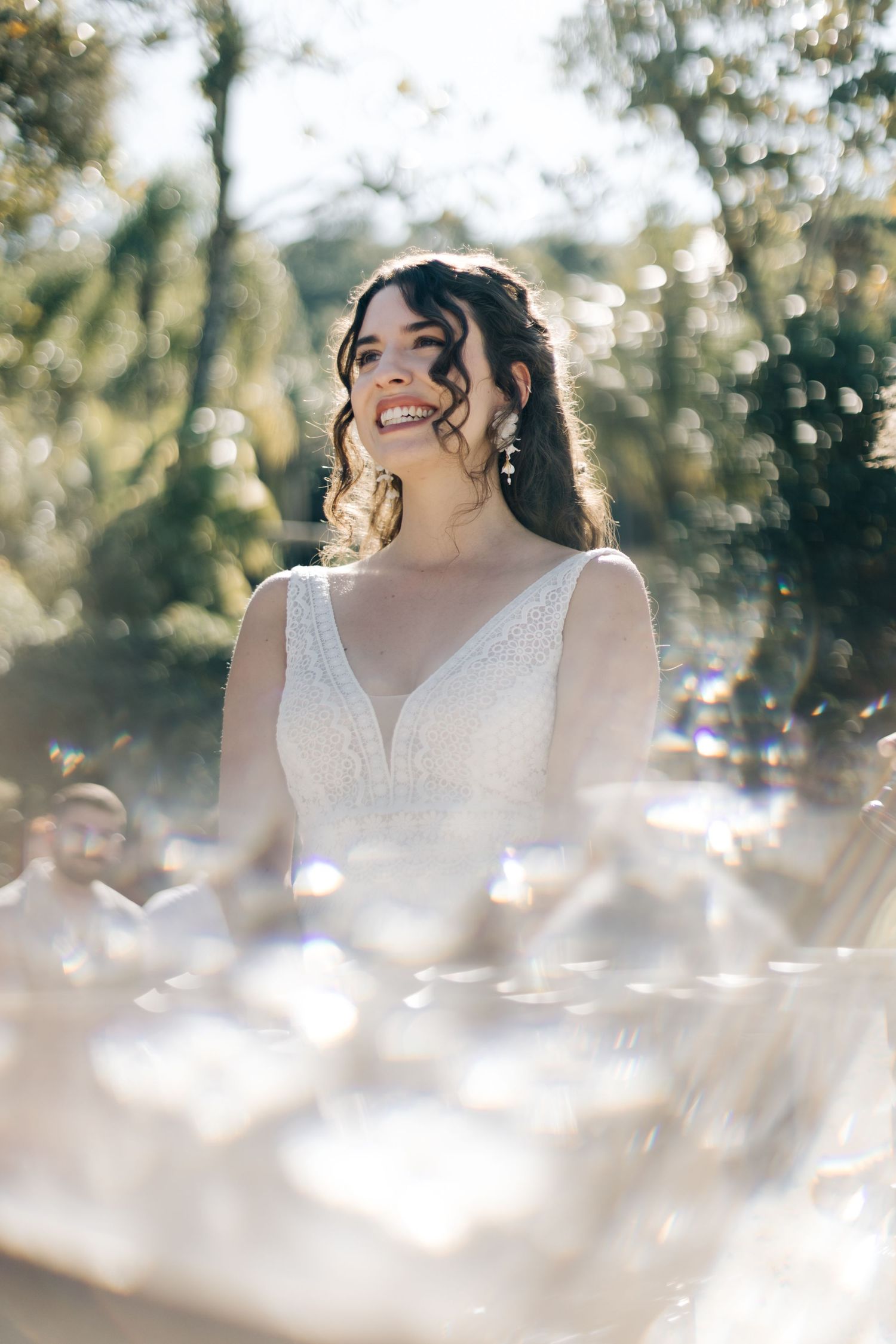Glowing outdoor wedding portrait with dreamy lighting effects.