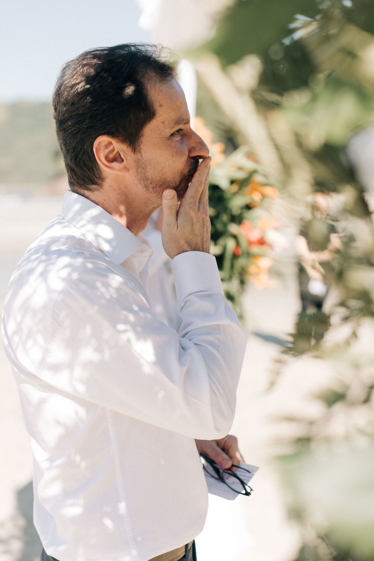 An emotional candid sequence captured during a touching moment at the wedding.