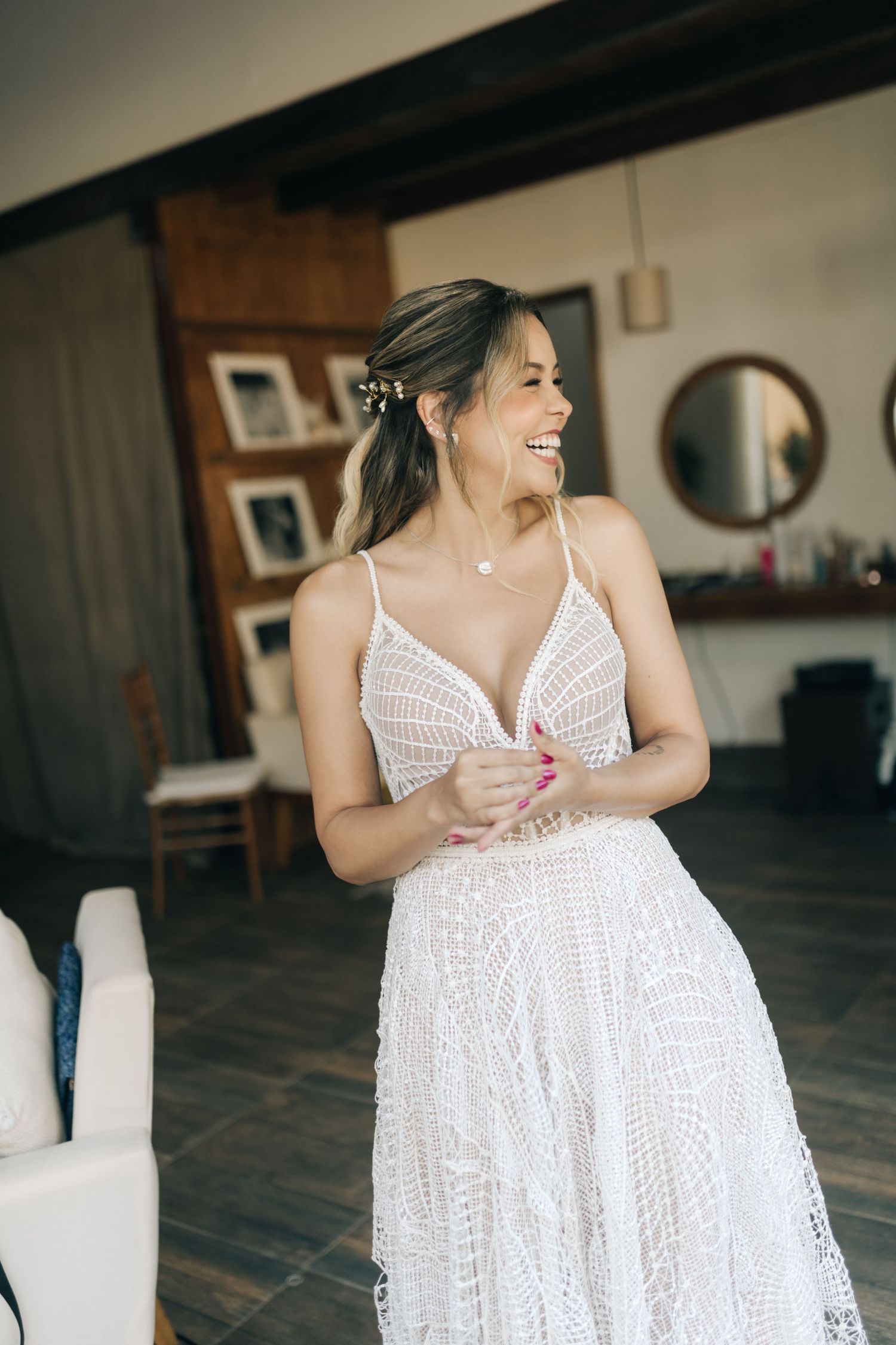 Series of candid moments showing movement in a white lace dress indoors.