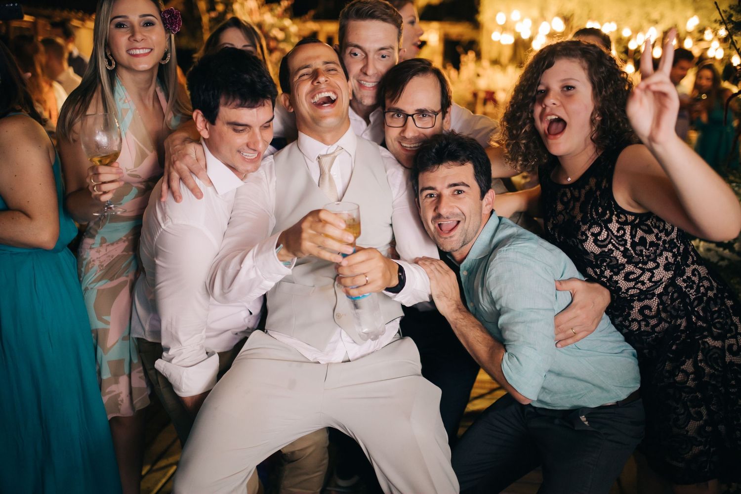 Party guests enjoying themselves with animated expressions during a lively celebration.