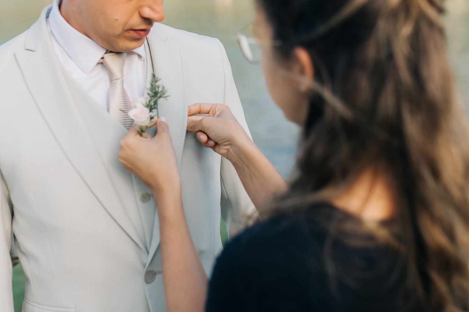 Close-up details of a wedding ceremony with floral decorations.
