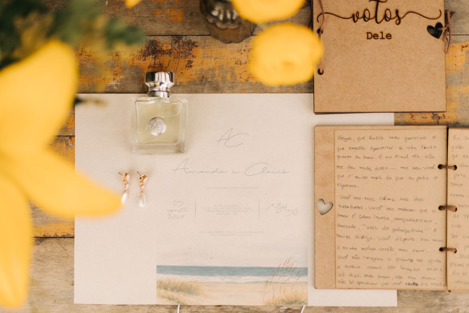 Wedding details featuring handwritten notes and perfume bottle with yellow floral accents.