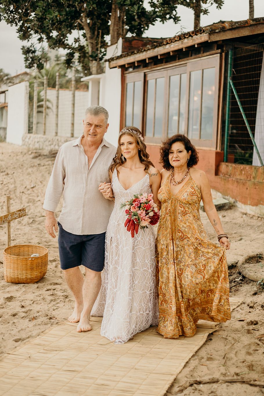 A special moment captured at a beachfront wedding ceremony with elegant attire.