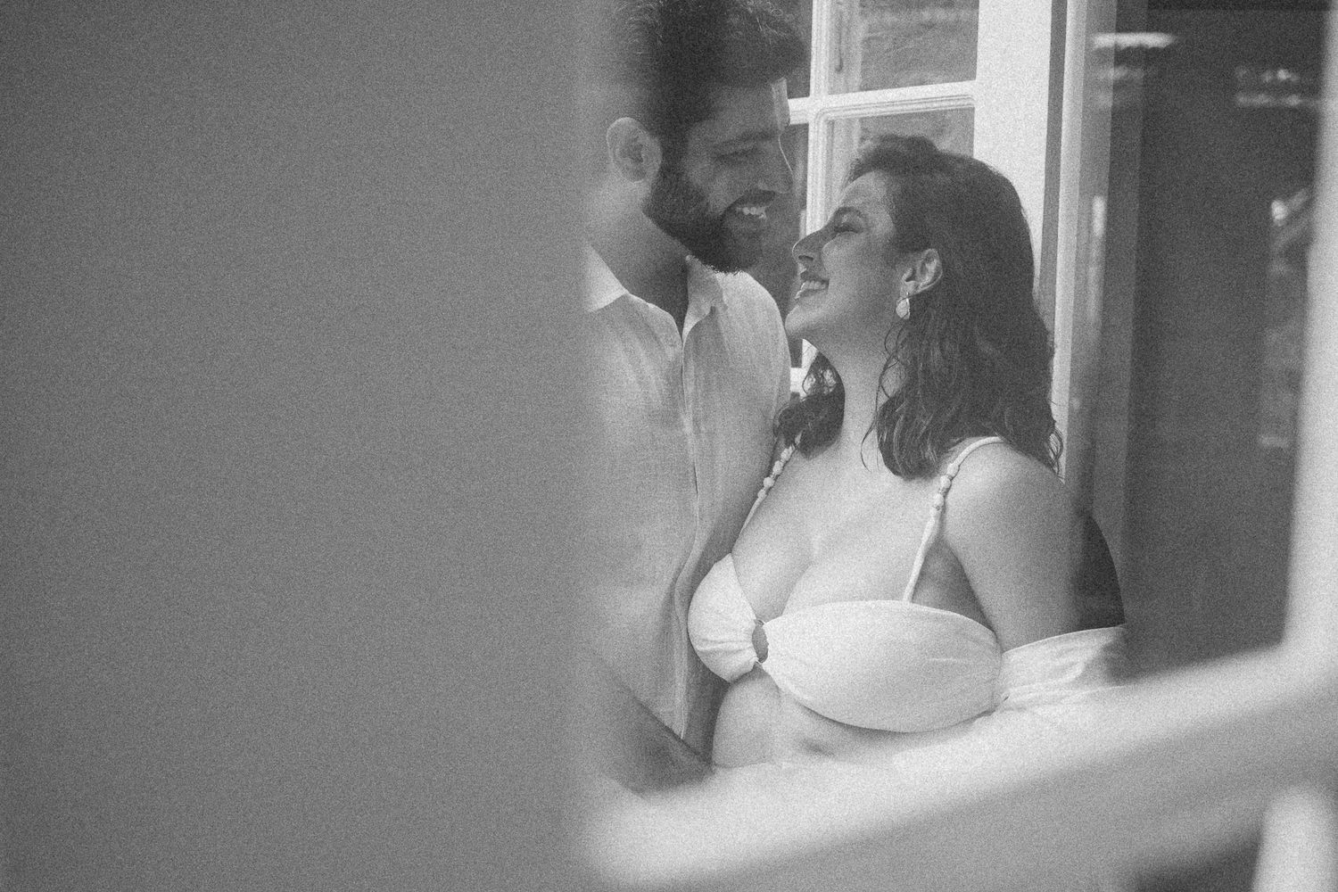 A couple shares a romantic moment while dancing together at their wedding celebration.