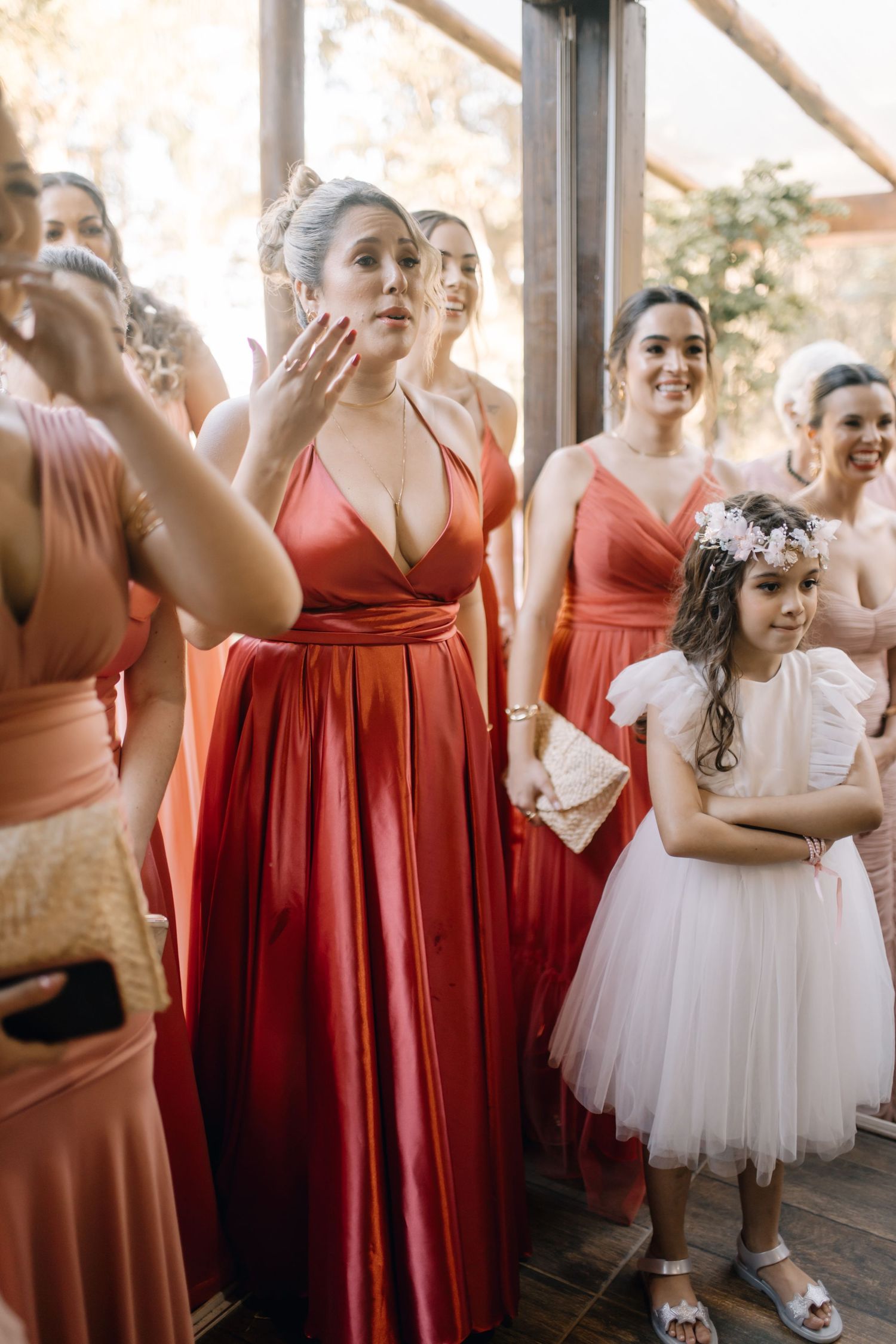 Wedding party members share emotional reactions during celebration.