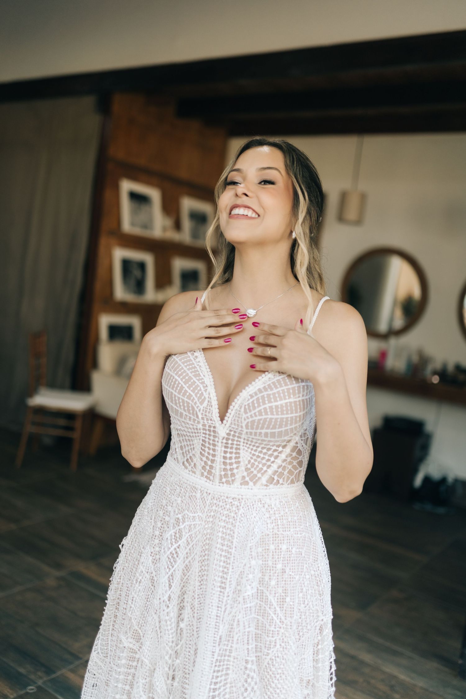 White lace dress with detailed bodice shown in expressive indoor photo sequence.