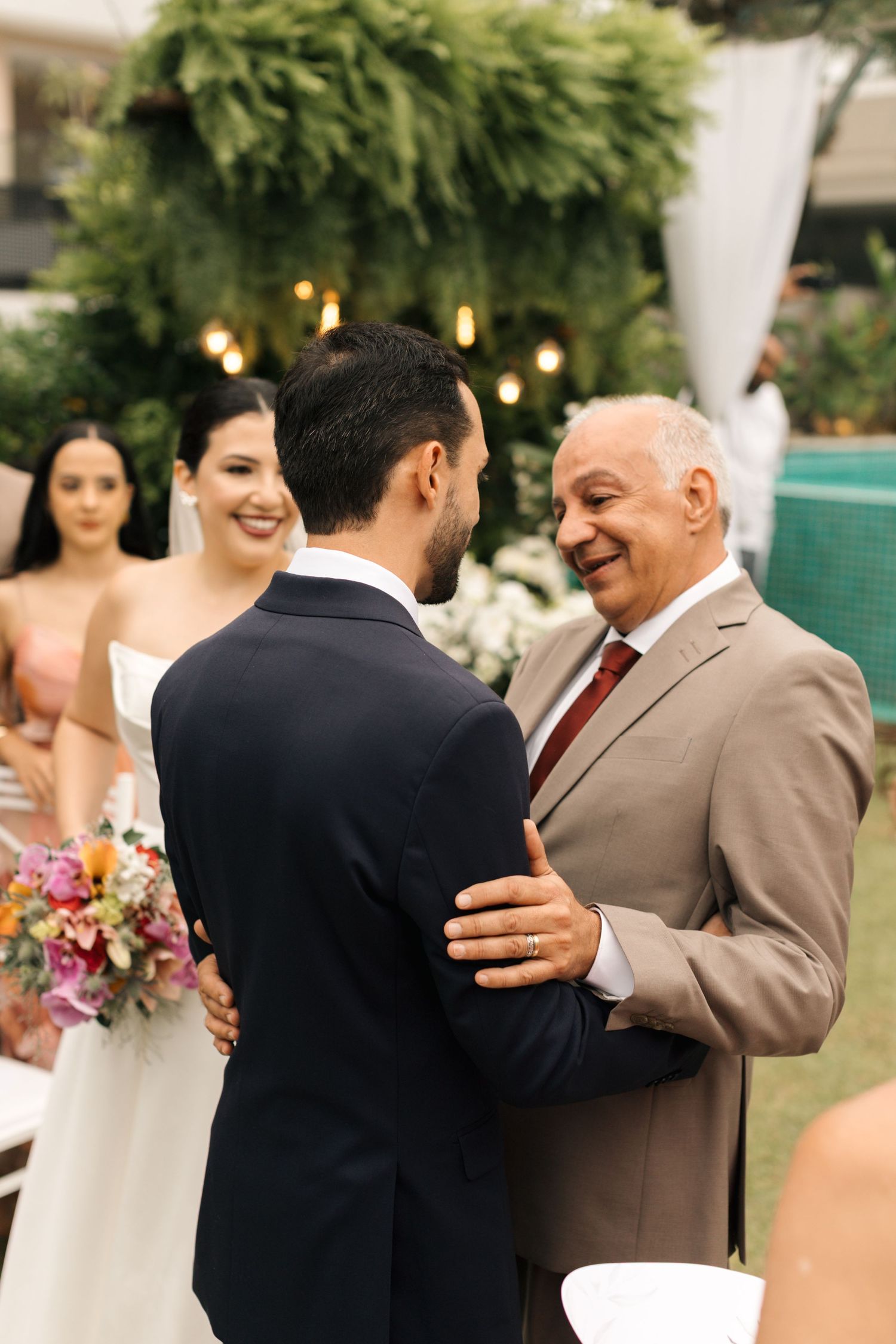 Emotional wedding celebration moments captured in an outdoor garden setting.