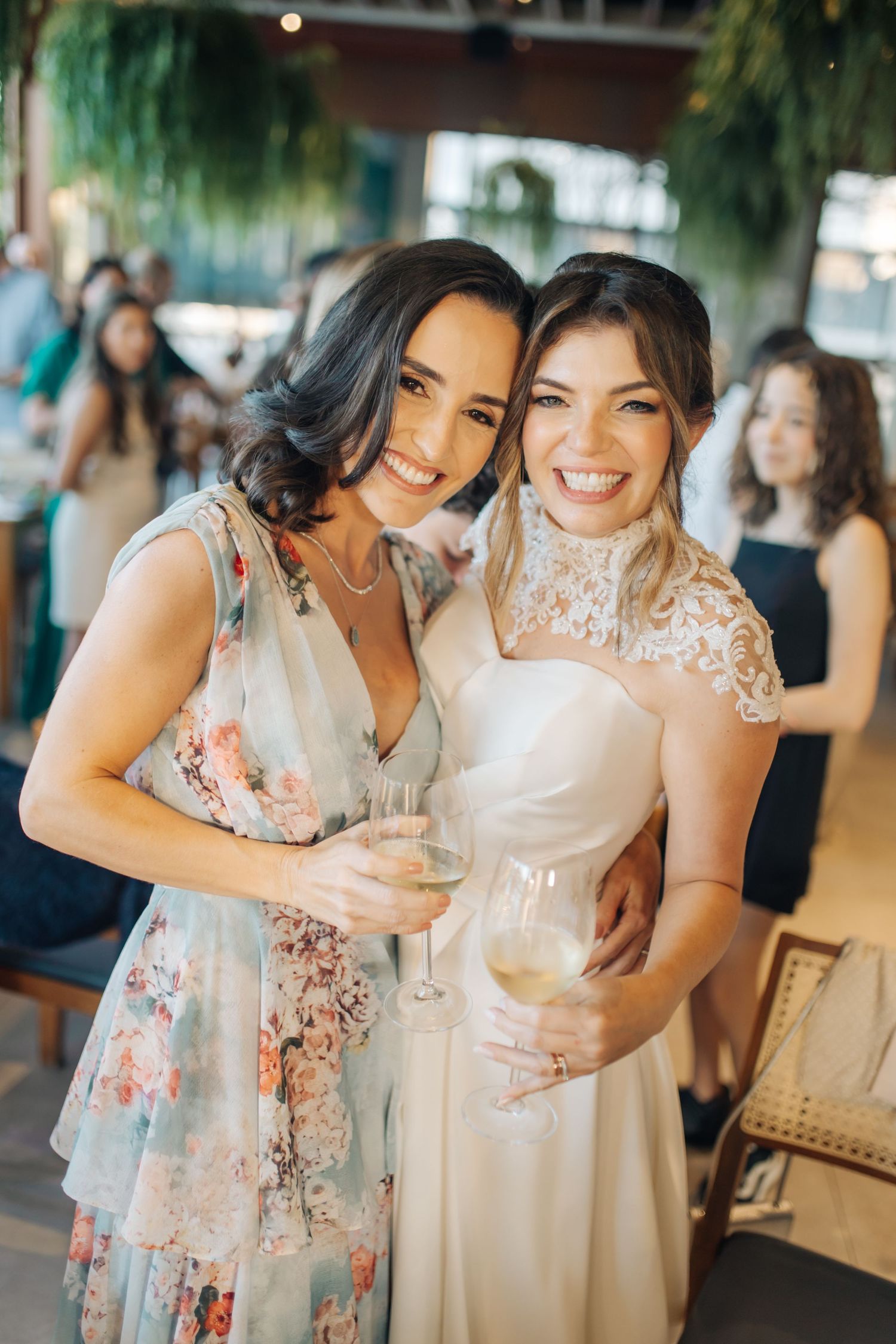 Candid moments of wedding guests sharing laughter and embraces during a celebration.