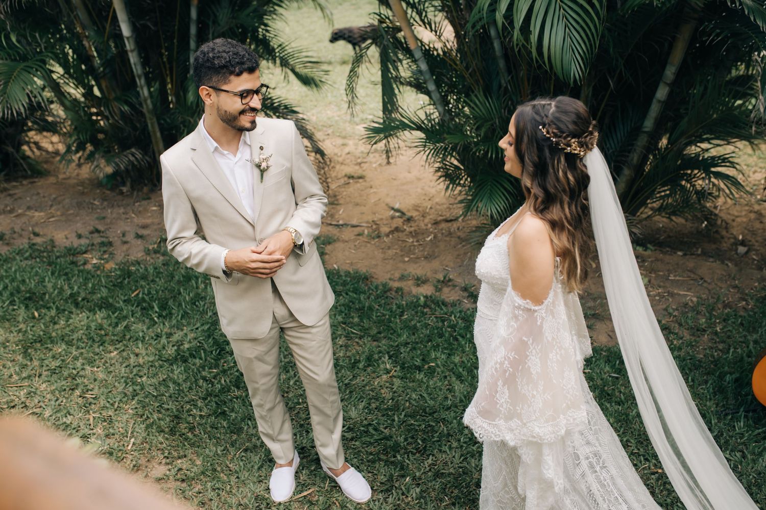 A couple sharing a romantic moment during their garden wedding ceremony.