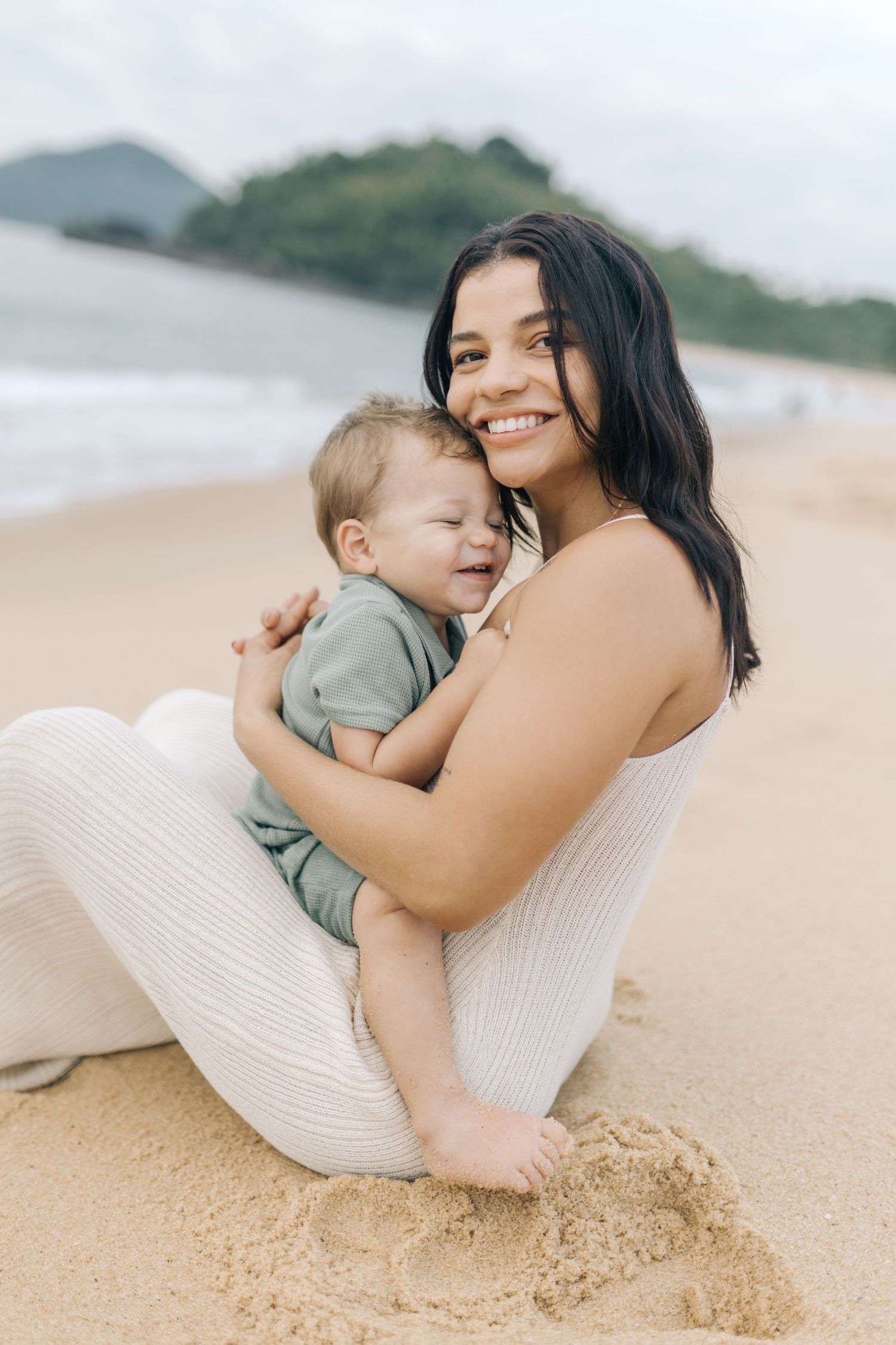 Intimate family portrait captured during a relaxing day at the beach.