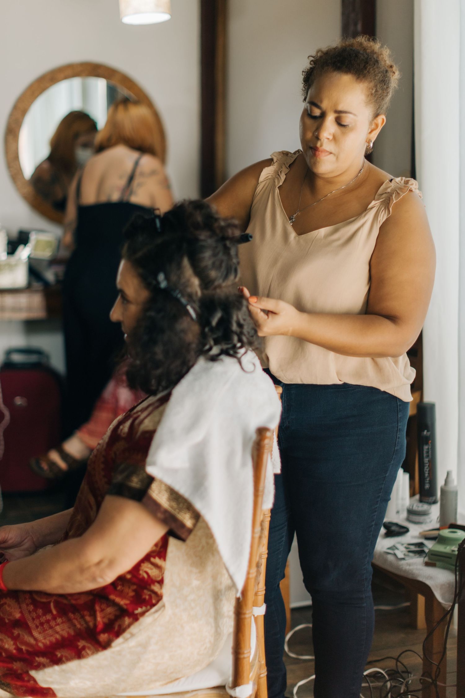 Professional beauty services being performed in a bright, modern salon space.