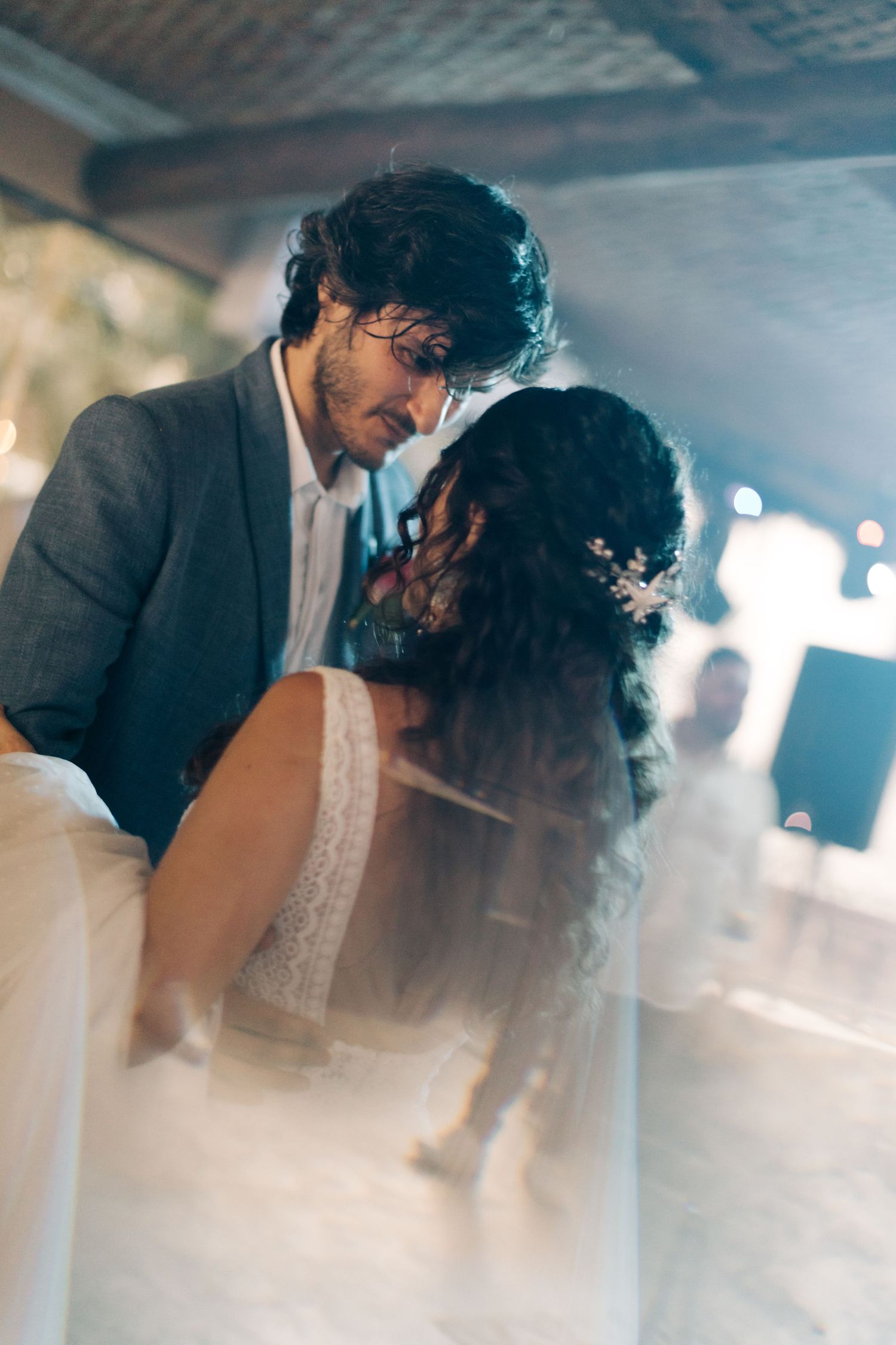 Intimate dance moment between newlyweds at their wedding reception.
