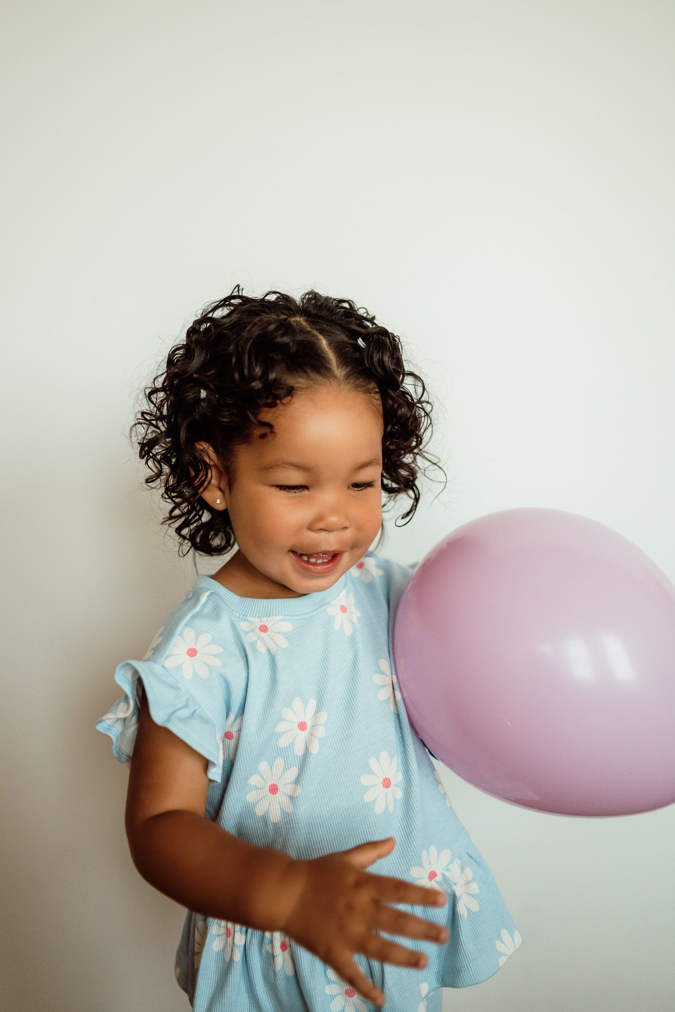 Toddler standing and laughing, milestone portrait session near Philadelphia