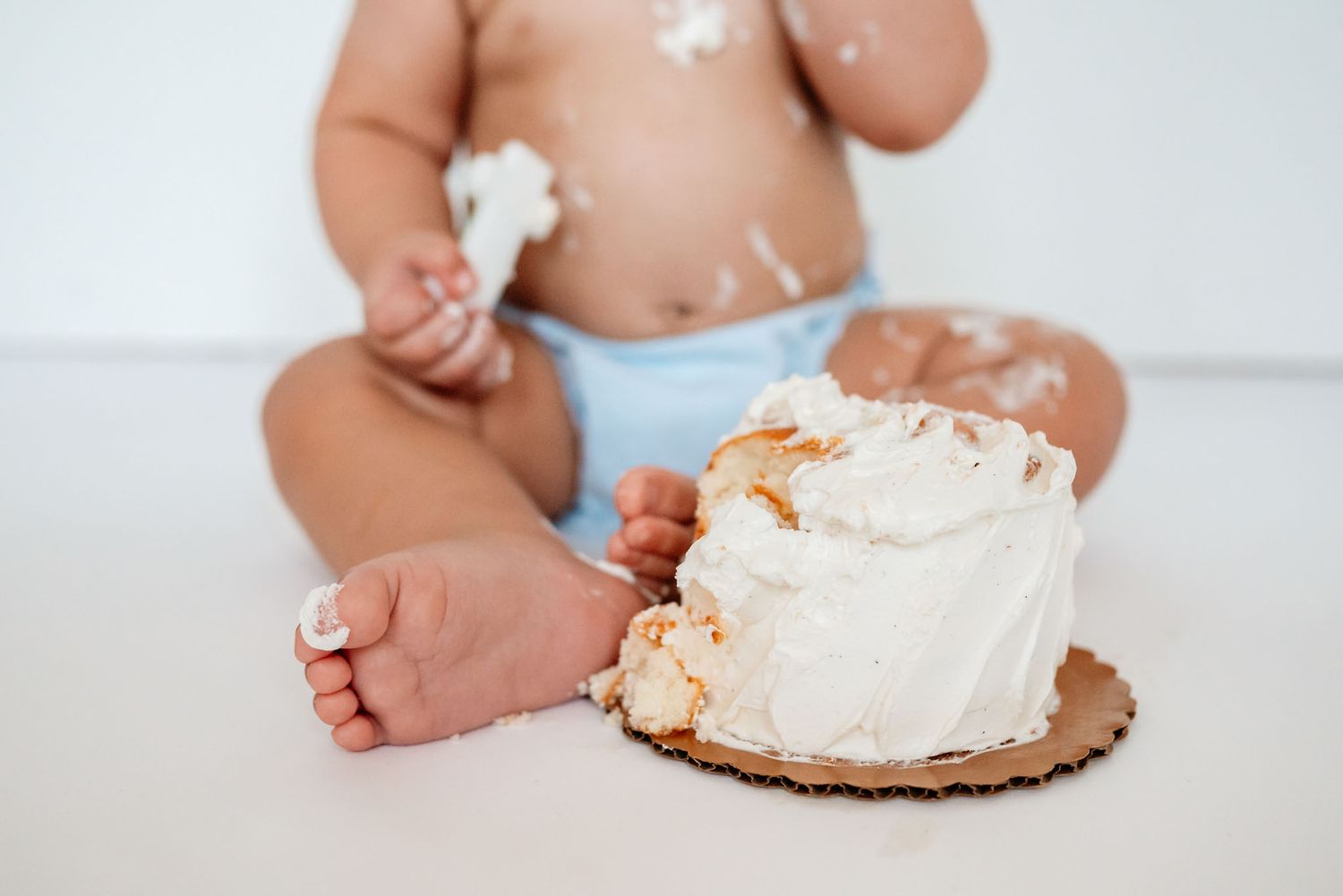 One year old smashing birthday cake, cake smash photography, Philadelphia area