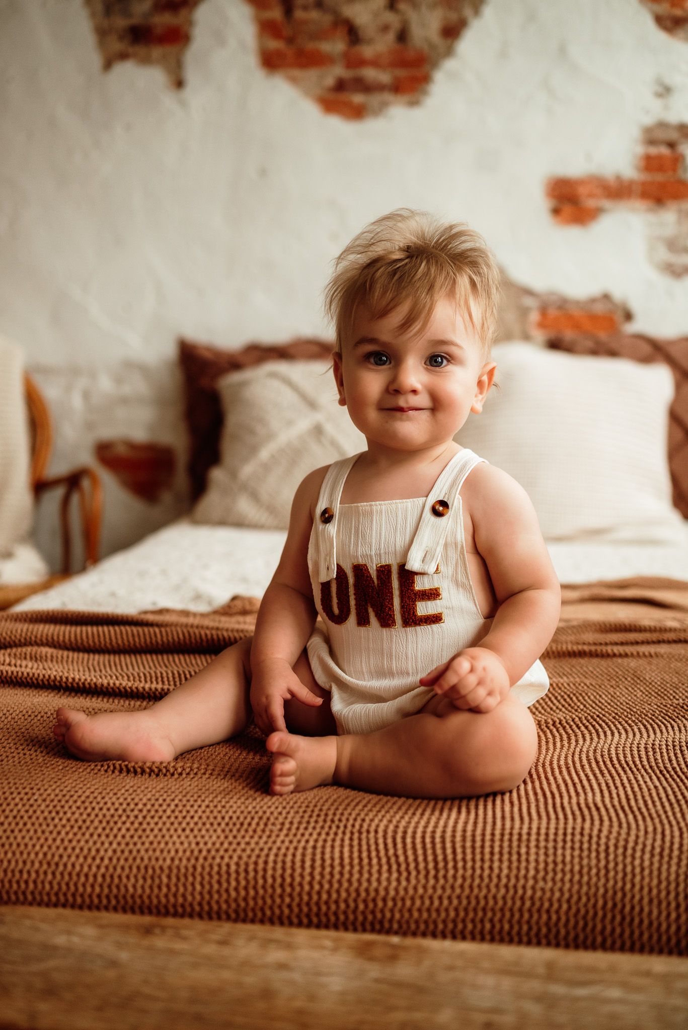 Baby sitting up in white onesie, sitter milestone session, Collegeville PA
