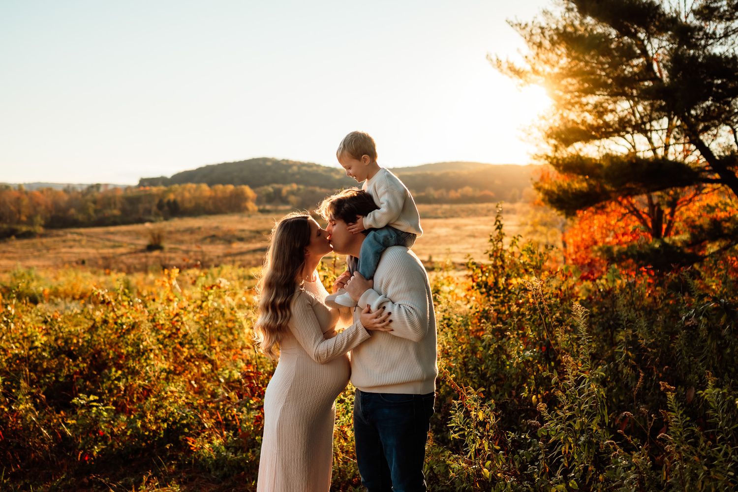 Pregnant mom with toddler kissing her belly, family maternity session, Montgomery County PA