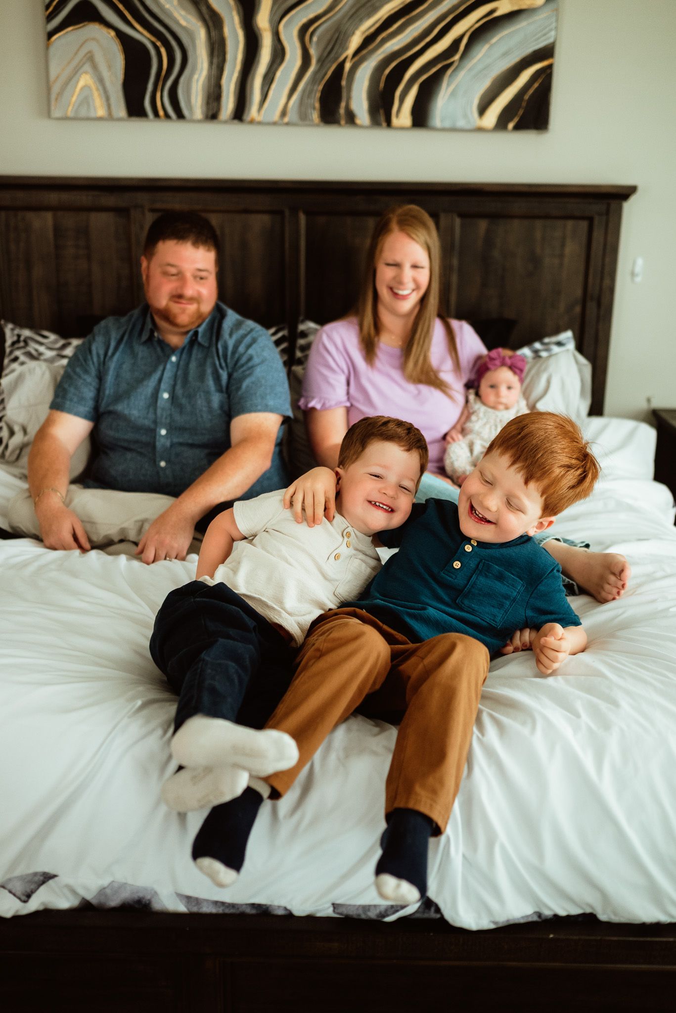 Siblings meeting newborn baby for first time, lifestyle in-home session, Philadelphia area