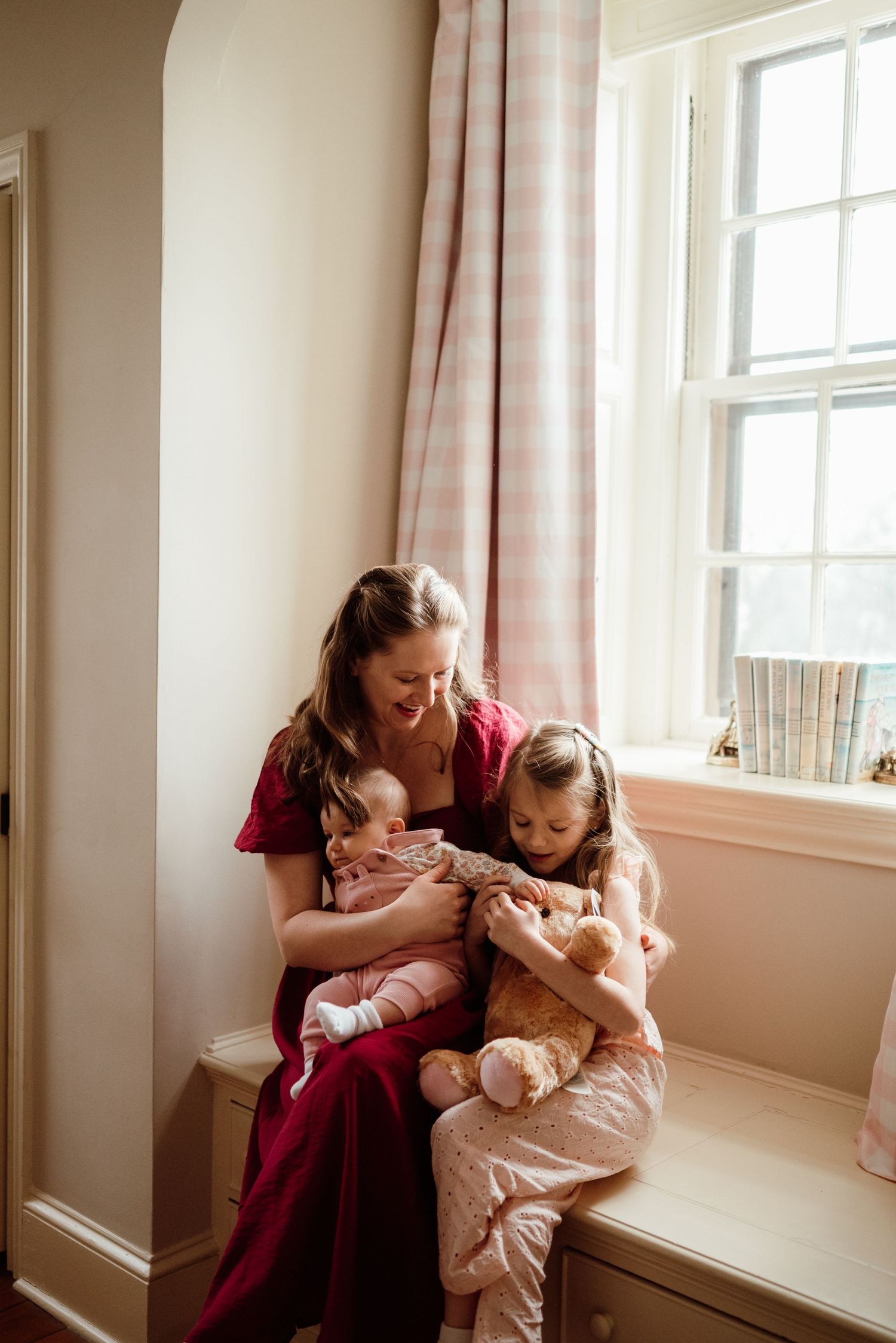 Mom and daughter laughing together, candid family portraits, Phoenixville PA