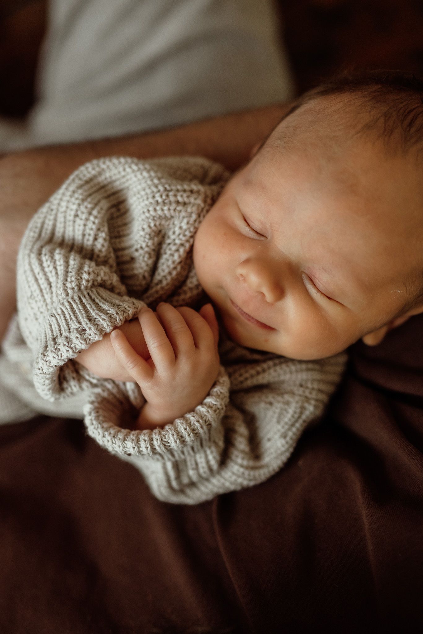 Dad holding newborn on chest, emotional newborn portrait, Phoenixville, PA