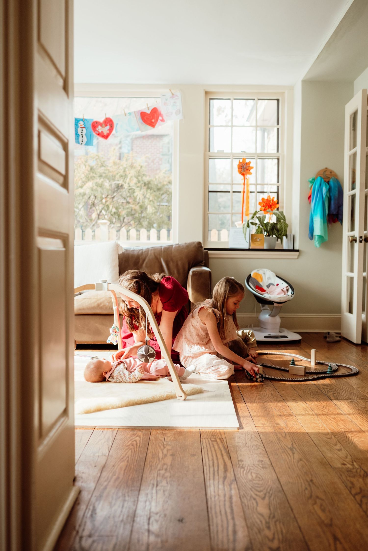 Mom and daughter laughing together, candid family portraits, Phoenixville PA