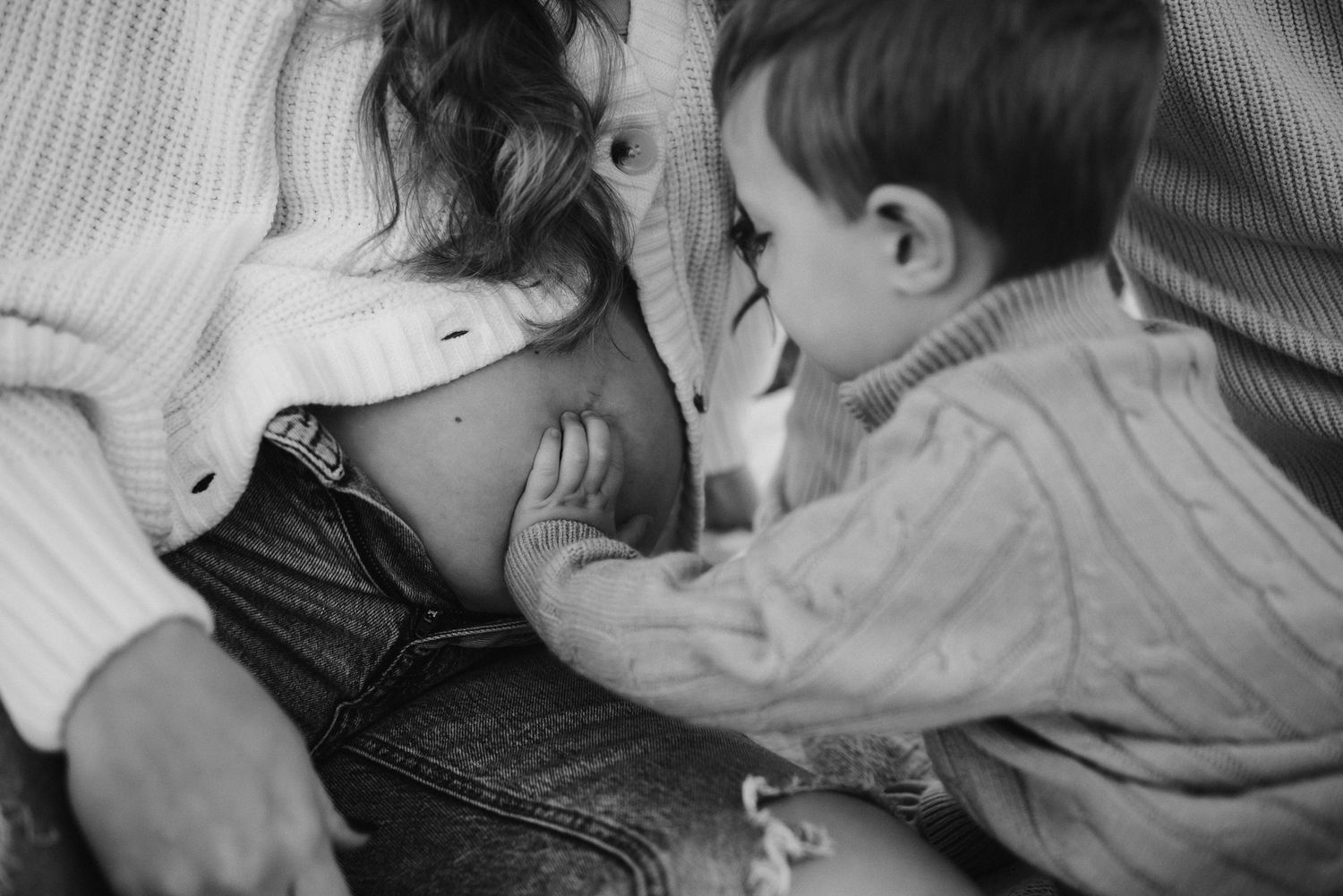 Pregnant mom with toddler kissing her belly, family maternity session, Montgomery County PA