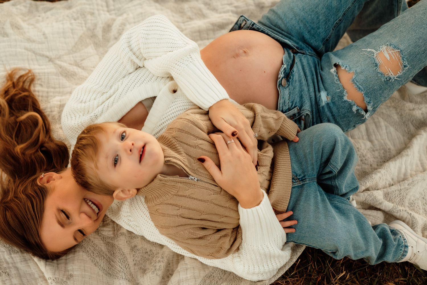 Pregnant mom with toddler kissing her belly, family maternity session, Montgomery County PA