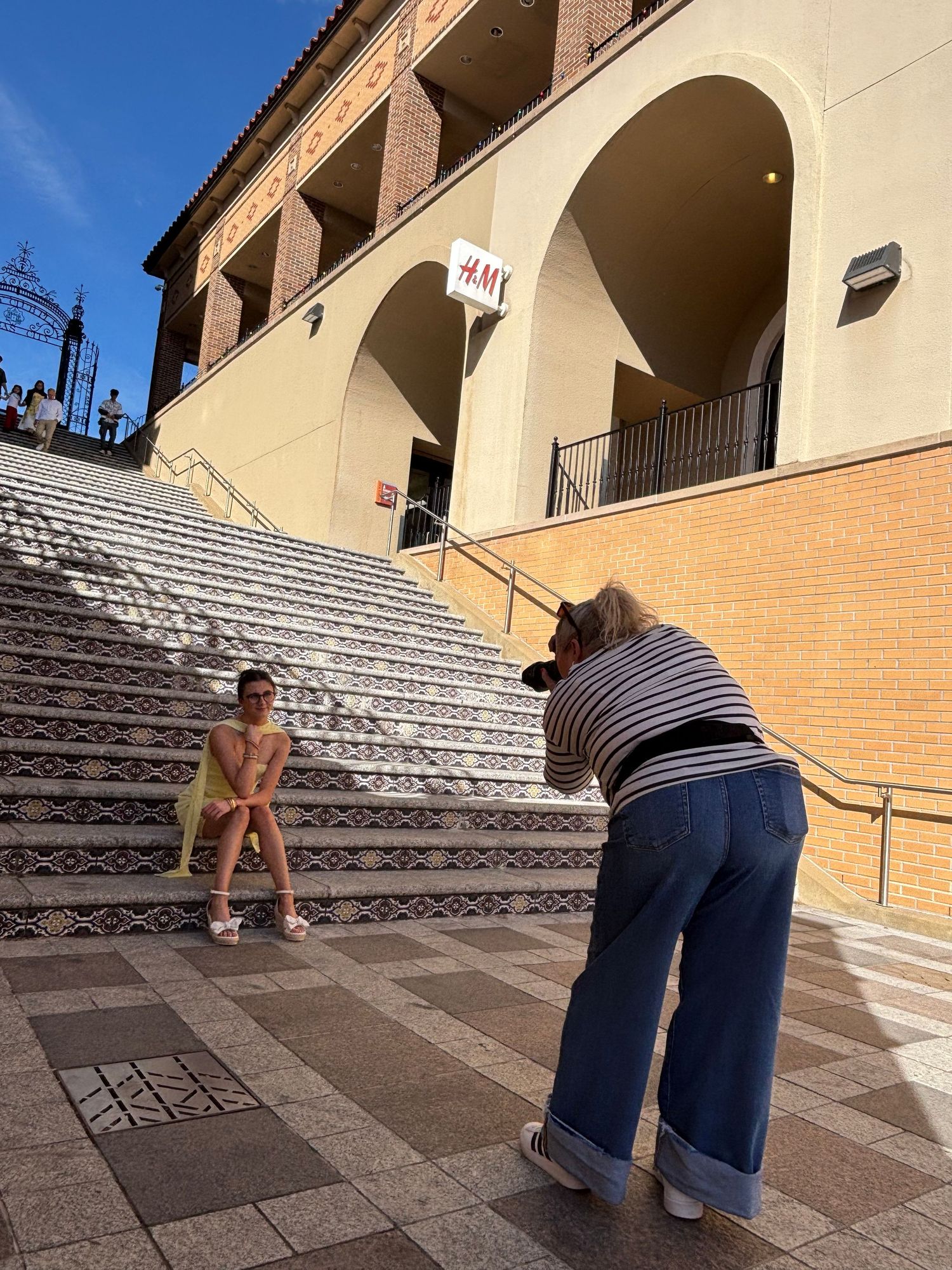 Person demonstrates hopscotch game progression on concrete steps in a series of connected photos.