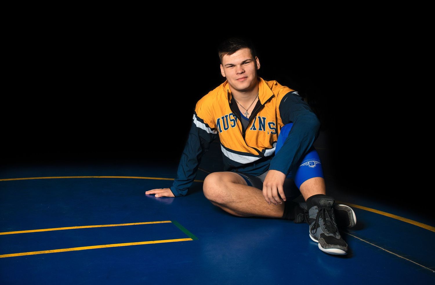 Athletic poses on a dark background with blue and yellow accents.