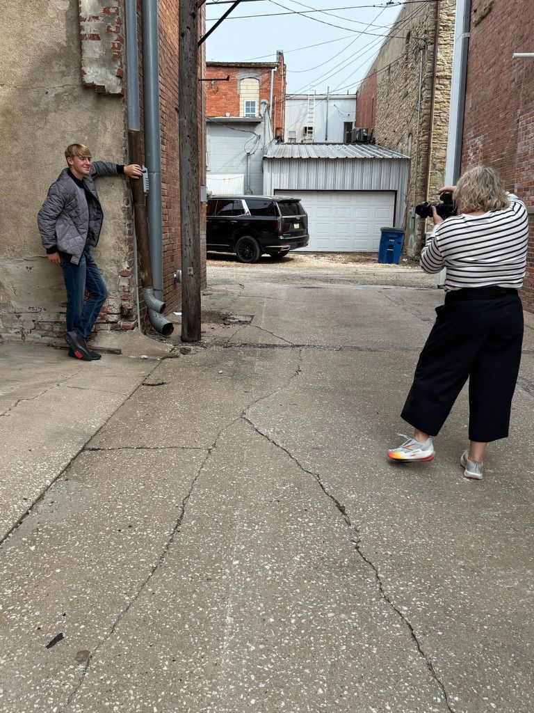 A sequence of photos showing people playing a casual game of bocce ball on a concrete surface near brick buildings.