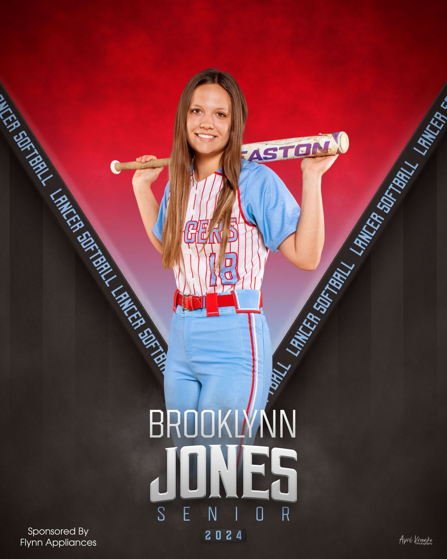 Senior sports portrait series in light blue uniform against dramatic red backdrop.