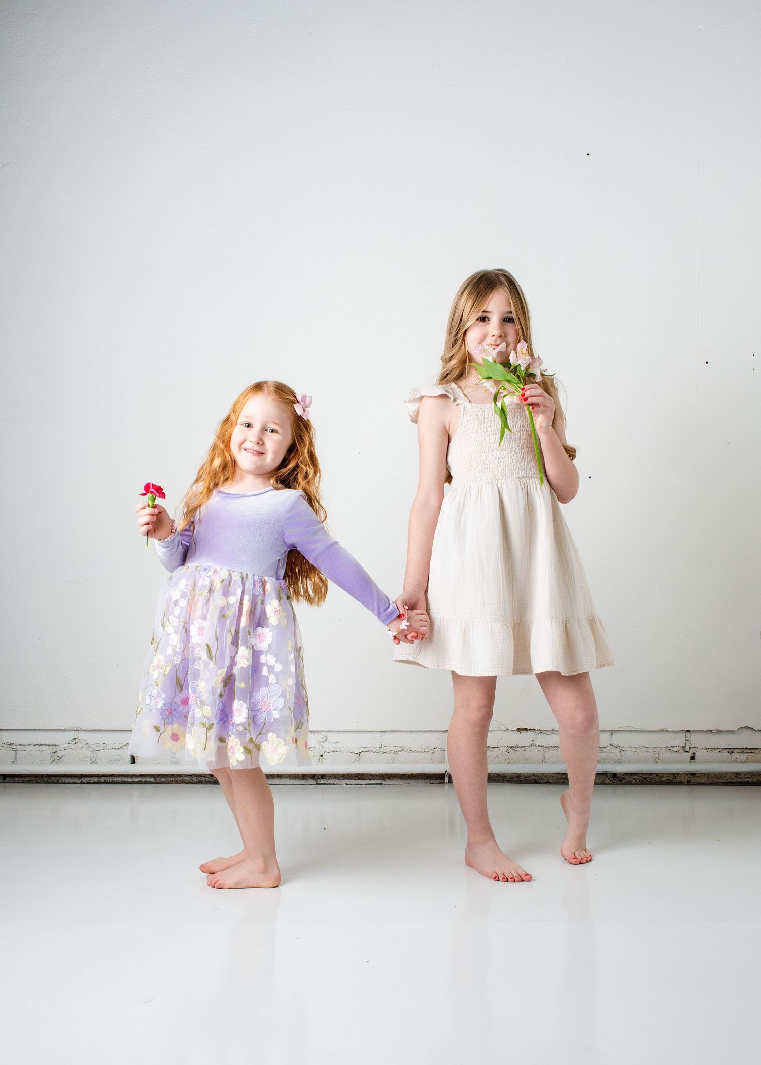 Creative portrait series showing partial views of people in light colored dresses.