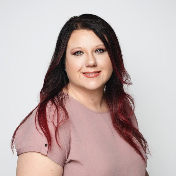 Professional headshots showing a person in a pink top against a white background.
