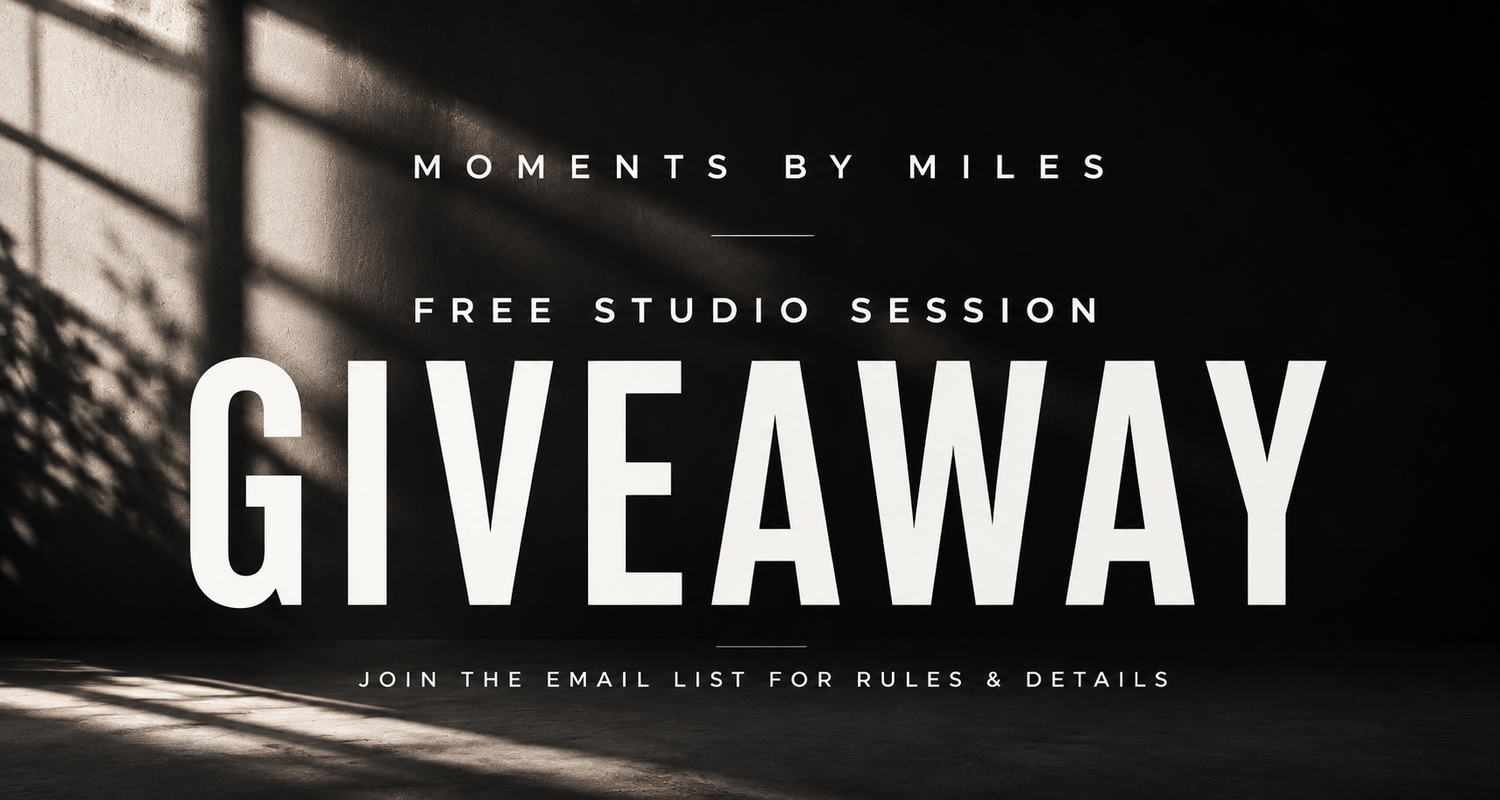 Dark studio background with dramatic lighting promoting a free studio session giveaway by Moments by Miles.