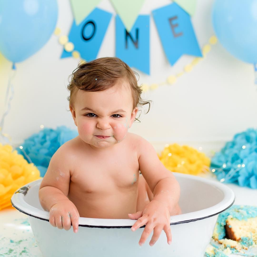 one year old boy in a tub first birthday