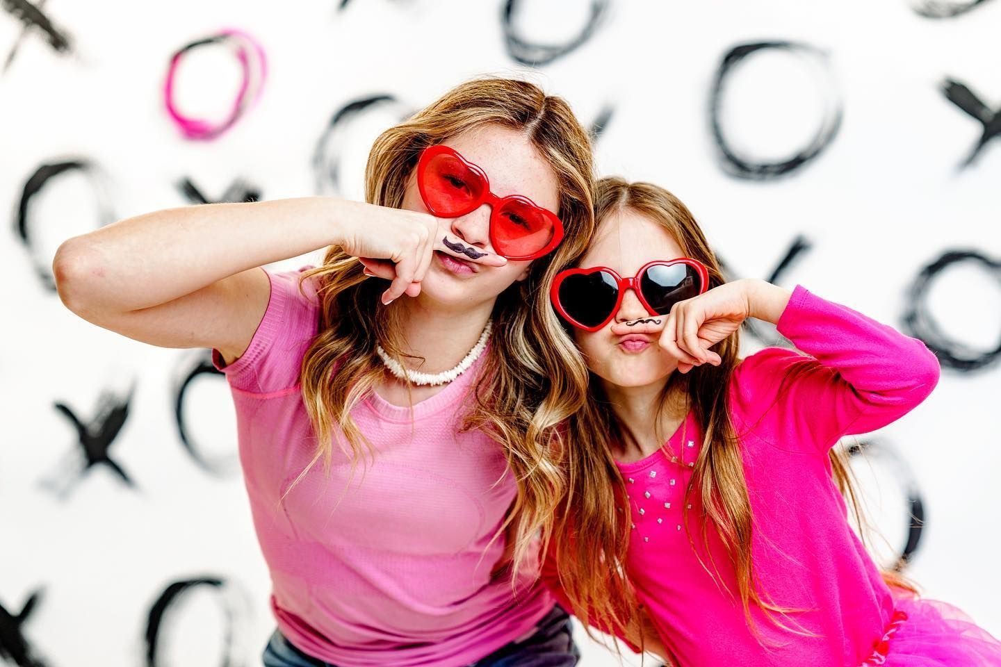 Fun studio portrait of siblings wearing sunglasses during a creative portrait session