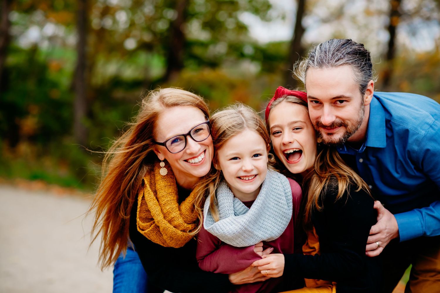Outdoor family portrait capturing connection and laughter during a family photography session