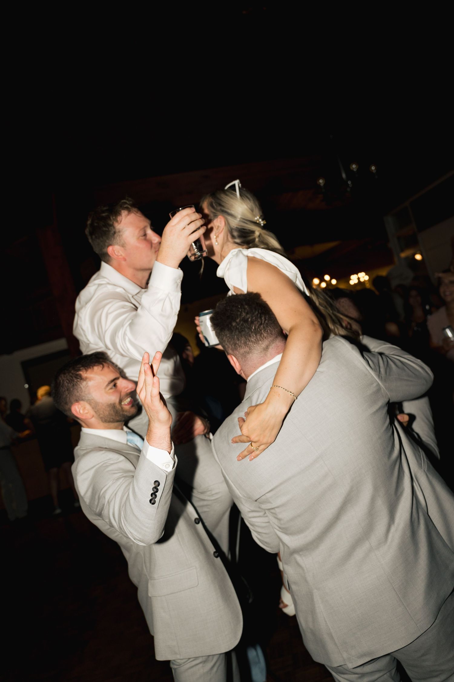 Wedding guests dancing and celebrating during nighttime reception party in Halifax, Nova Scotia.