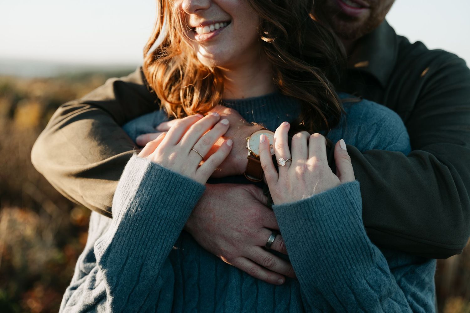 A couple embraces in a romantic golden hour photoshoot outdoors in nature in Halifax, Nova Scotia.