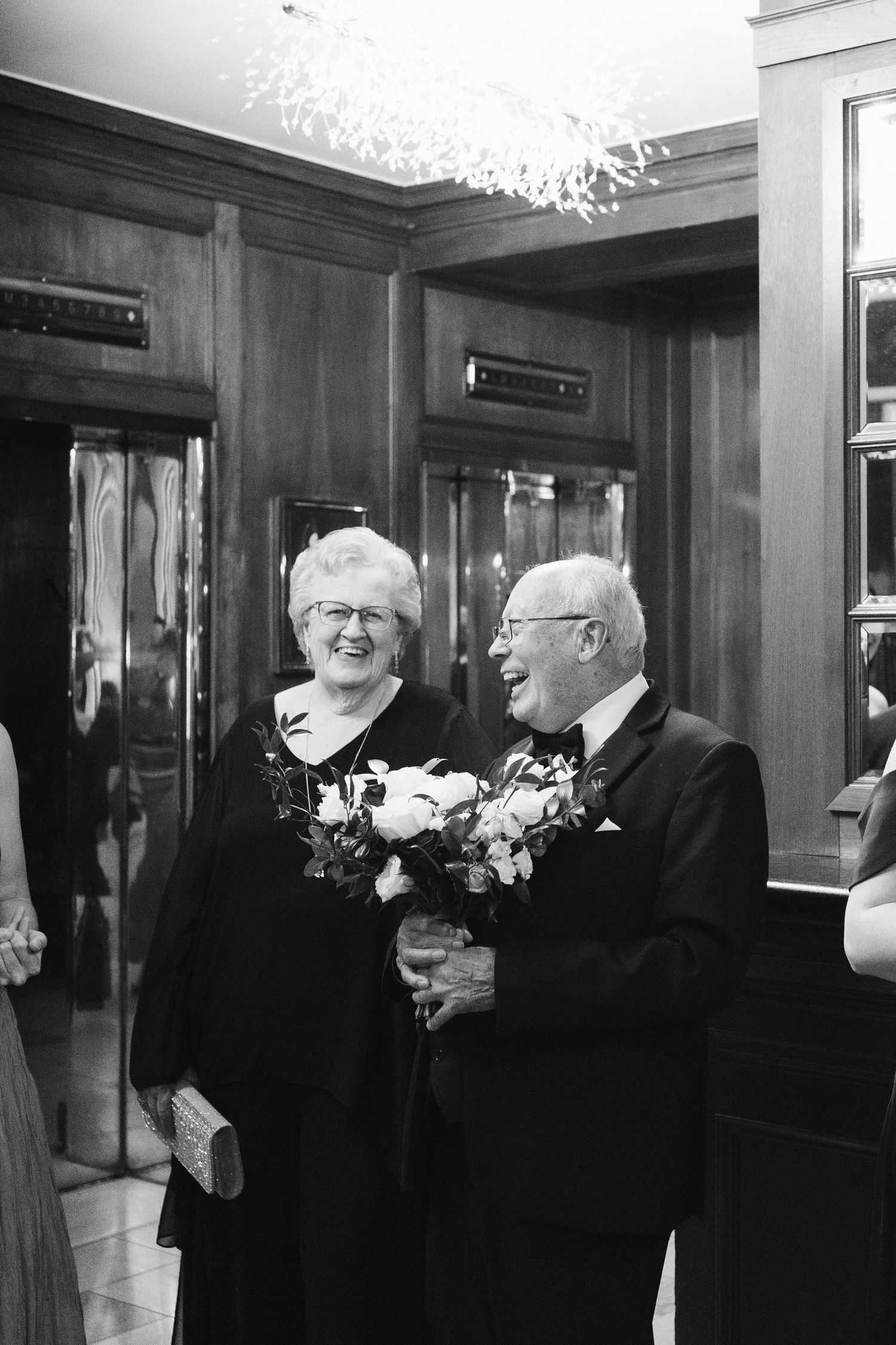 Black and white photos showing guests mingling at an elegant indoor reception venue at Lord Nelson Hotel, Halifax, Nova Scotia.