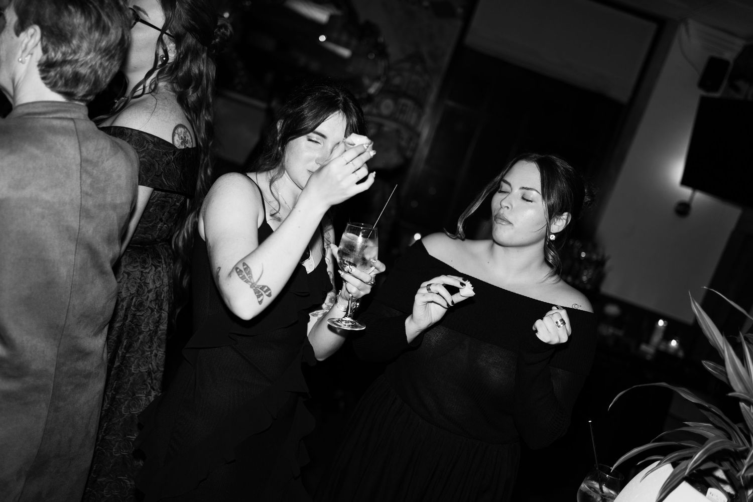 Intimate black and white candid shots of guests enjoying drinks at a wedding reception at Lord Nelson Hotel, Halifax, Nova Scotia.