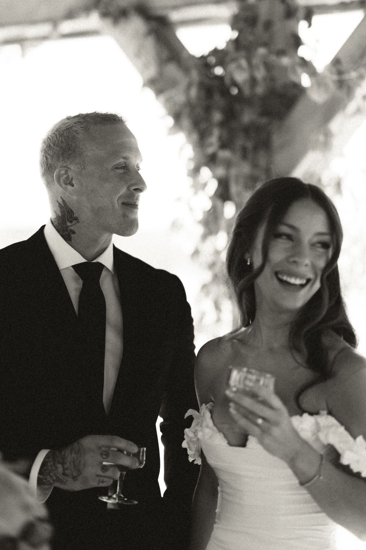 Black and white sequence of candid wedding reception moments showing laughter and champagne toast in Halifax, Nova Scotia.