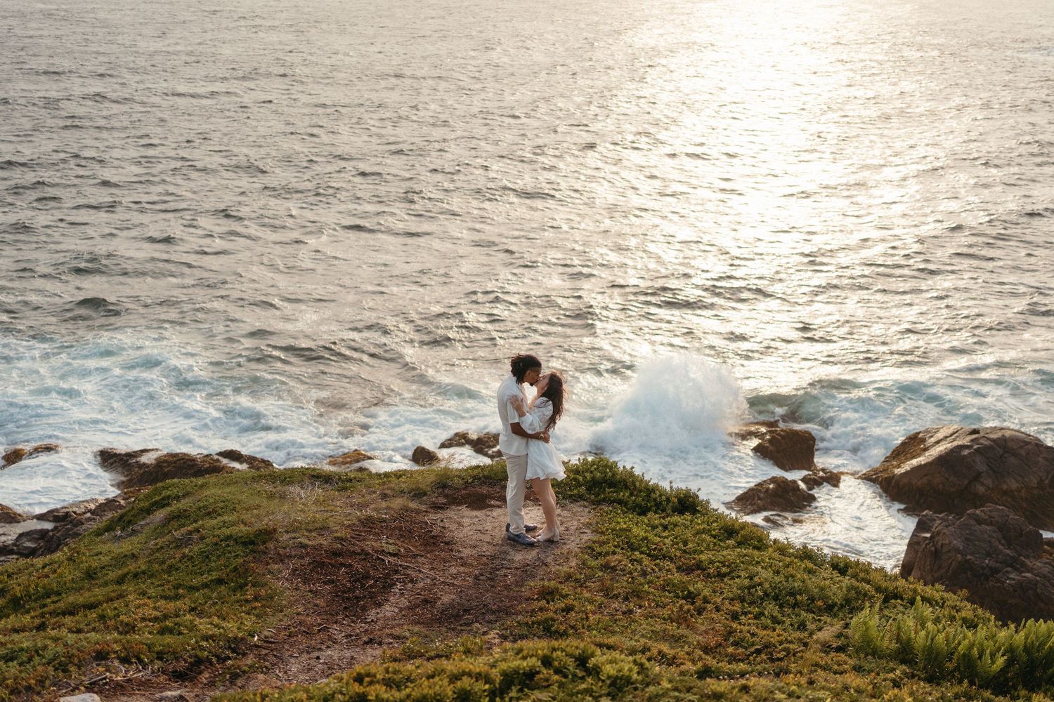 A series of coastal landscape photos showing rocky cliffs and ocean views at sunset along a rugged shoreline in Halifax, Nova Scotia.