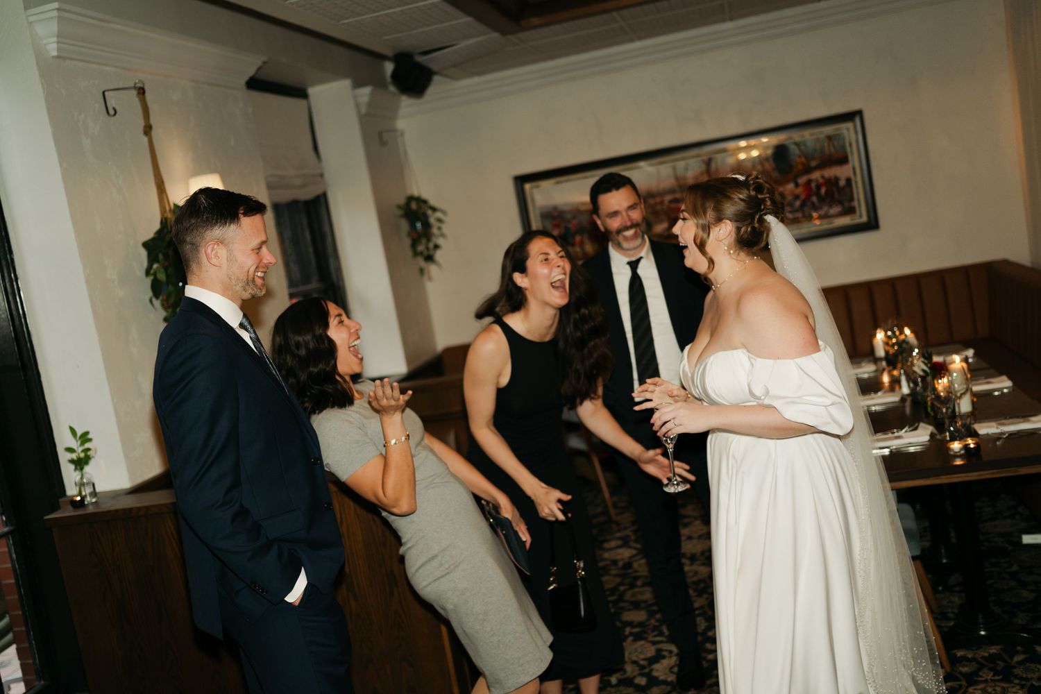 A lively wedding reception scene with guests dancing and celebrating in an indoor venue at Lord Nelson Hotel, Halifax, Nova Scotia.